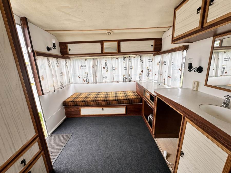 Caravan interior with seating and kitchenette