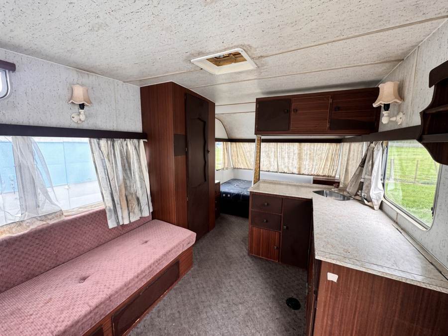 Caravan lounge, kitchen and double bed